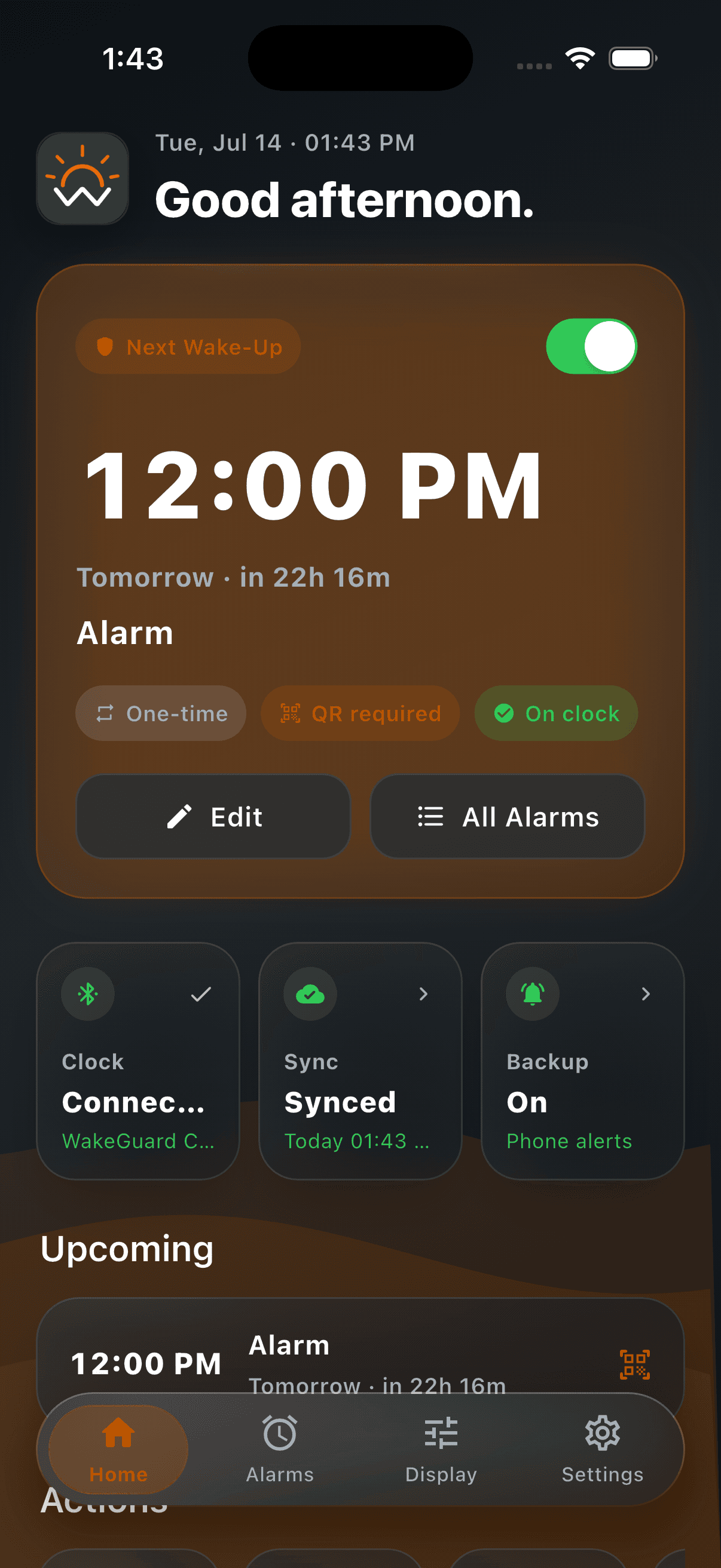 WakeGuard home screen showing a protected alarm, connected clock status, and backup status.